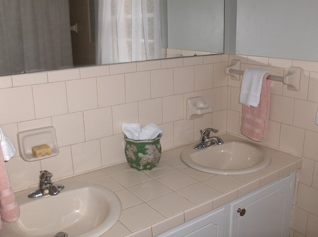 bathroom featuring a sink and double vanity