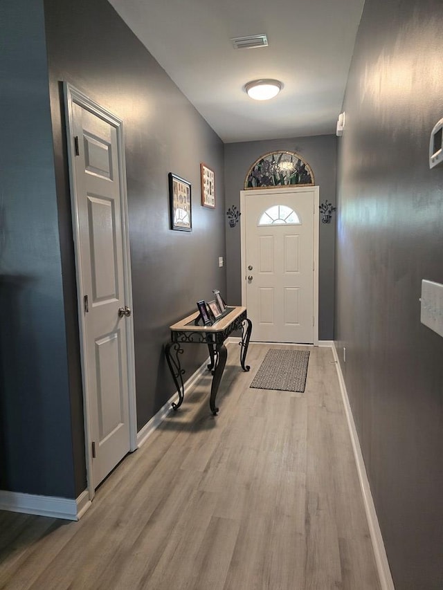 doorway to outside featuring light hardwood / wood-style floors