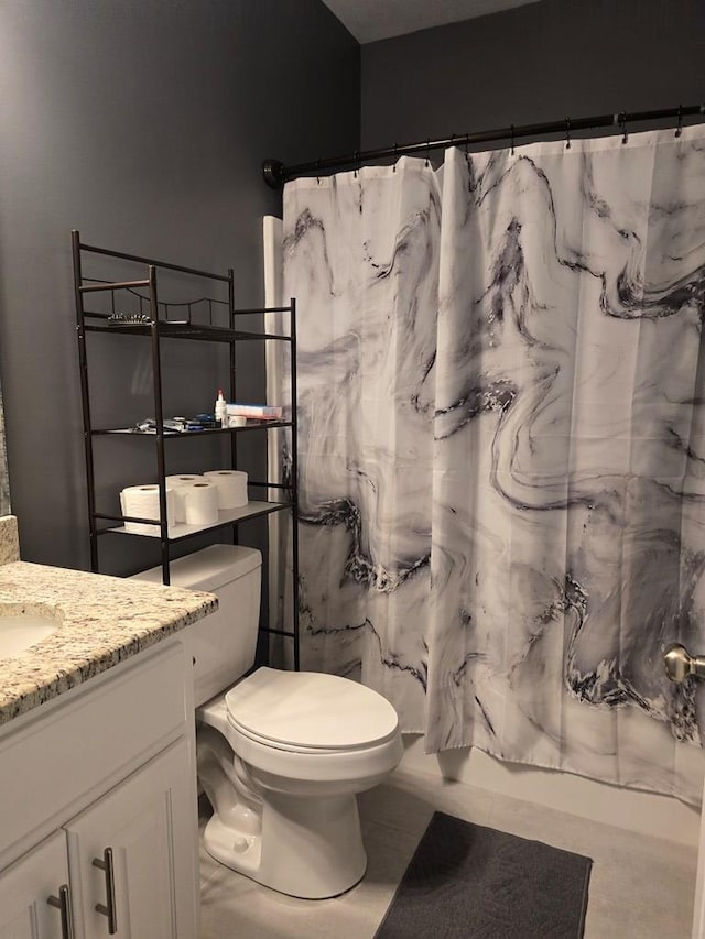 full bathroom with toilet, shower / bath combination with curtain, vanity, and tile patterned floors