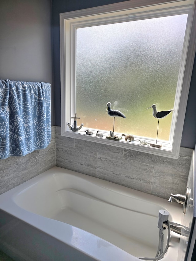 bathroom with a tub