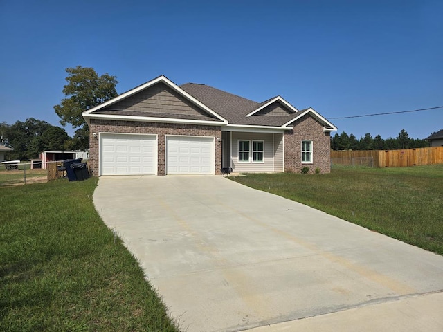 view of front of home featuring a garage and a front lawn