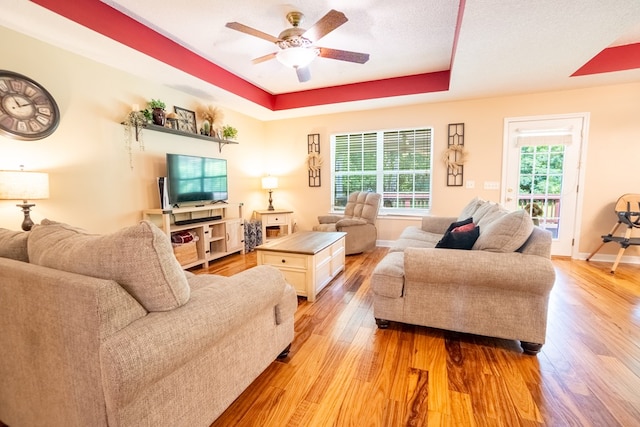 330 Brushfire Dr, Dothan, AL 36305 - living area featuring a ceiling fan, light wood-style flooring, and a raised ceiling