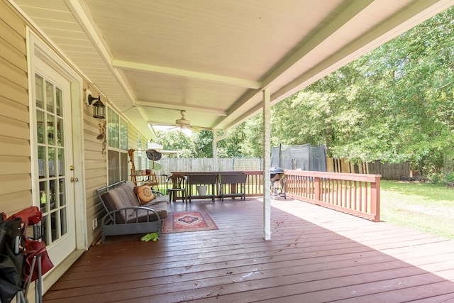 330 Brushfire Dr, Dothan, AL 36305 - wooden deck featuring a trampoline, a fenced backyard, and outdoor dining area