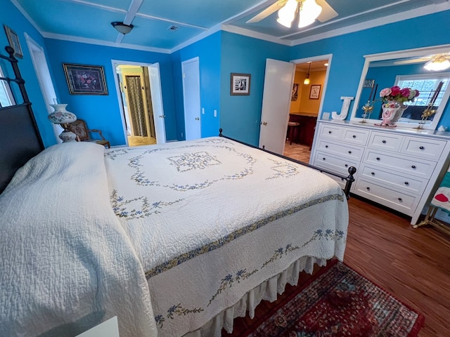 bedroom featuring ensuite bathroom, ceiling fan, and dark wood-style flooring