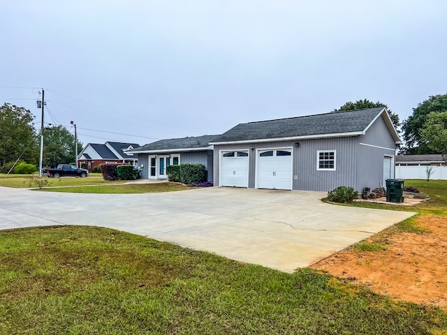 exterior space featuring a lawn and a garage