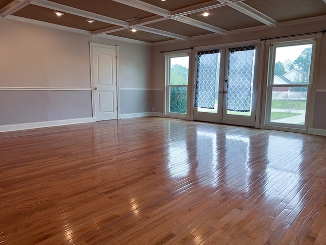 unfurnished room featuring hardwood / wood-style flooring, french doors, baseboards, and coffered ceiling