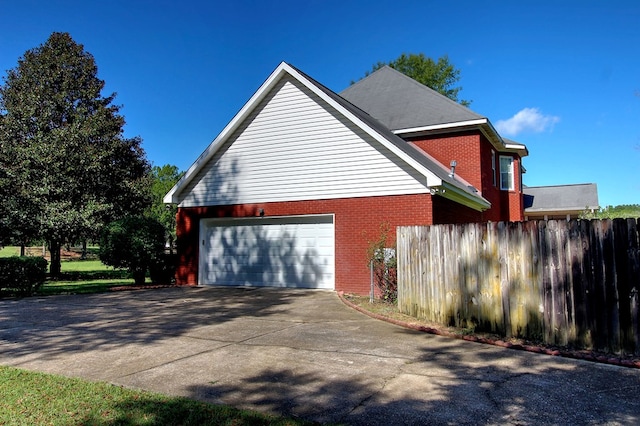 view of property exterior with a garage