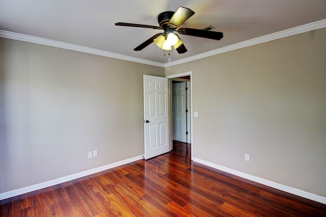 unfurnished room featuring ceiling fan, dark hardwood / wood-style floors, and ornamental molding