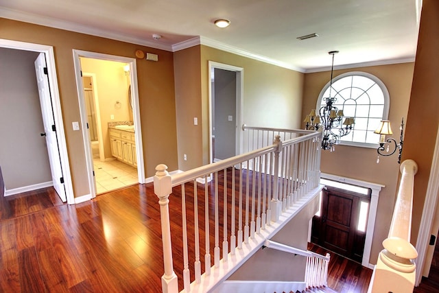 interior space featuring hardwood / wood-style floors and crown molding