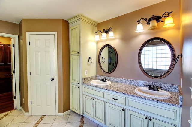 bathroom featuring tile patterned flooring and vanity