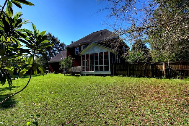 view of yard featuring a sunroom