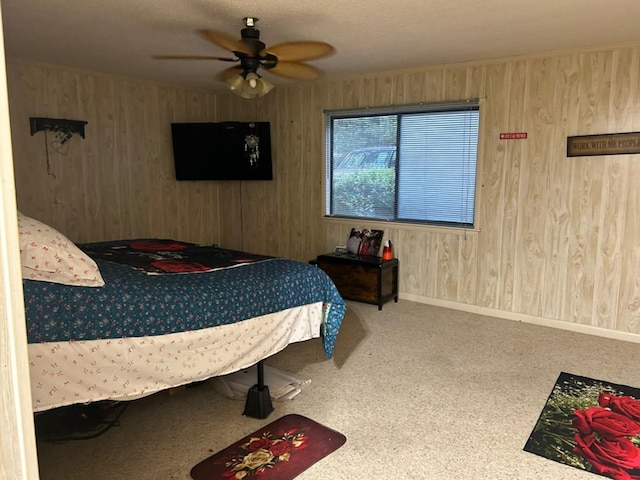 555 Cove Rd, Abbeville, AL 36310 - carpeted bedroom with wooden walls, baseboards, and a ceiling fan