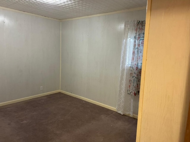 555 Cove Rd, Abbeville, AL 36310 - empty room featuring dark carpet, ornamental molding, and baseboards