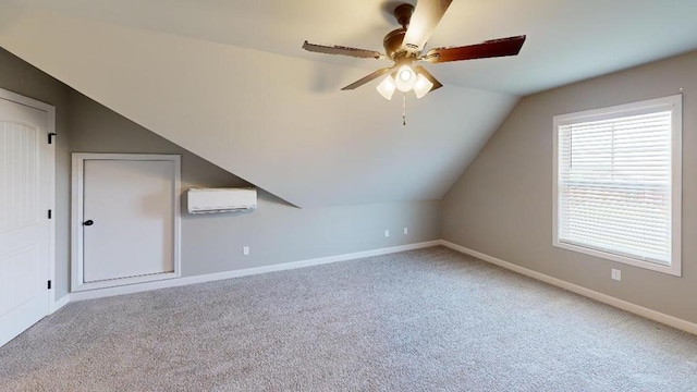 bonus room with carpet floors, vaulted ceiling, ceiling fan, and a wall unit AC