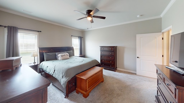 carpeted bedroom featuring ceiling fan and ornamental molding