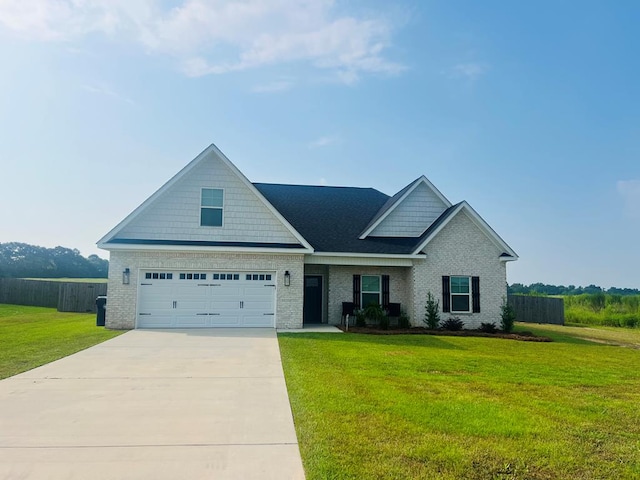 view of front of property with a front lawn and a garage