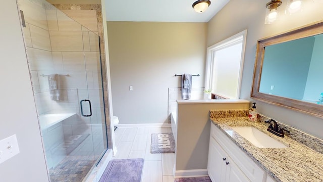 bathroom with a shower with door, vanity, and toilet