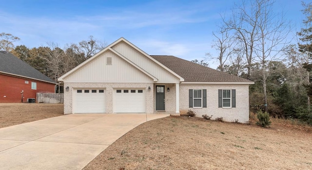 view of front of home featuring a garage and a front yard