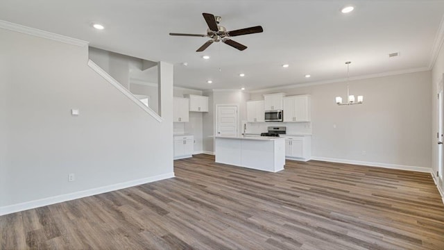 109 Creekridge St, Headland, AL 36345 - unfurnished living room featuring wood finished floors, crown molding, and ceiling fan with notable chandelier