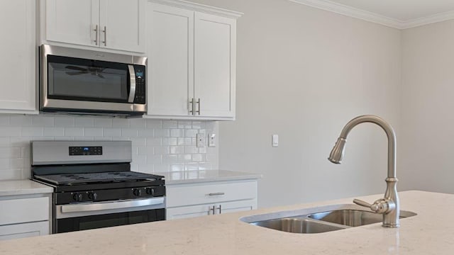 109 Creekridge St, Headland, AL 36345 - kitchen with decorative backsplash, stainless steel appliances, light stone counters, and a sink