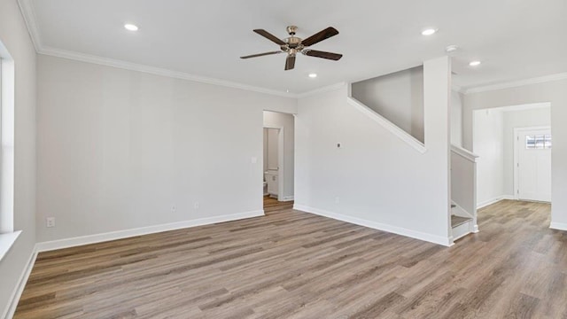 109 Creekridge St, Headland, AL 36345 - empty room with stairs, wood finished floors, recessed lighting, ceiling fan, and baseboards