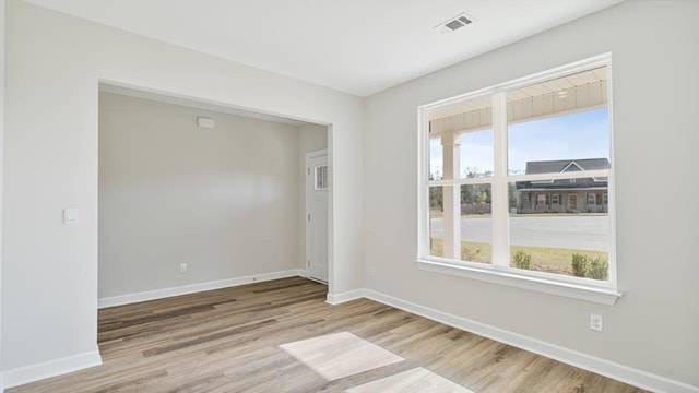109 Creekridge St, Headland, AL 36345 - unfurnished room with baseboards, a healthy amount of sunlight, visible vents, and wood finished floors