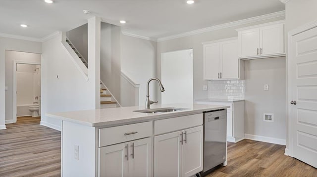 109 Creekridge St, Headland, AL 36345 - kitchen featuring a sink, light wood-type flooring, dishwasher, crown molding, and white cabinetry