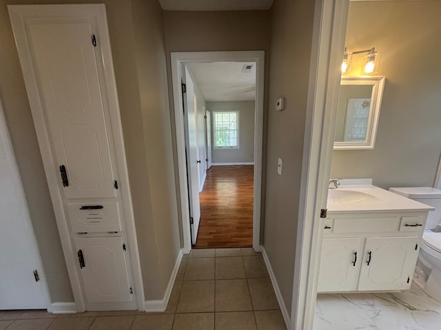 411 Kentworth Dr, Dothan, AL 36301 - hallway with baseboards and a sink