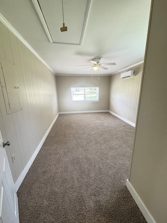 411 Kentworth Dr, Dothan, AL 36301 - unfurnished room with attic access, a wall unit AC, carpet flooring, electric panel, and crown molding