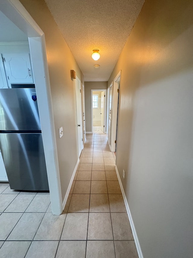 411 Kentworth Dr, Dothan, AL 36301 - hallway with light tile patterned floors and a textured ceiling