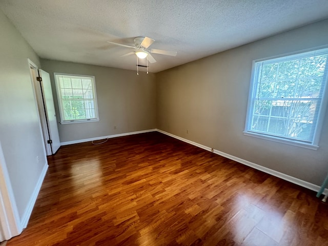 411 Kentworth Dr, Dothan, AL 36301 - unfurnished room with dark wood-style flooring, ceiling fan, and a textured ceiling