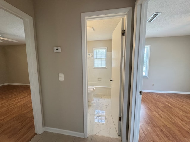 411 Kentworth Dr, Dothan, AL 36301 - corridor featuring a textured ceiling and light wood-type flooring