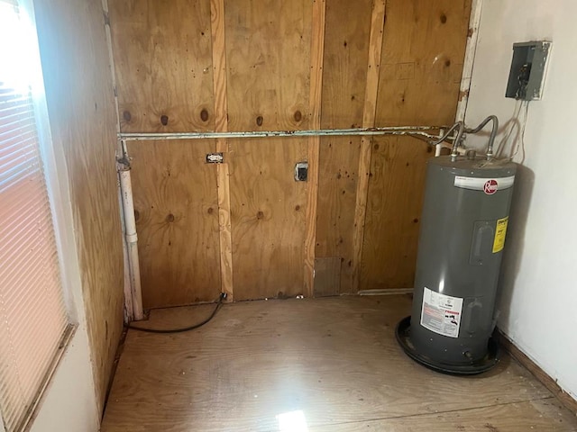 utility room with electric water heater