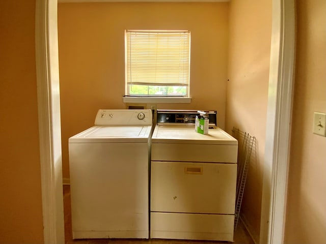 laundry room with laundry area and washing machine and clothes dryer