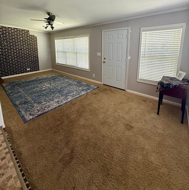 300 Mixson St, Enterprise, AL 36330 - carpeted entryway with crown molding, a ceiling fan, and a fireplace