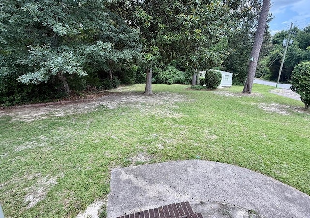 300 Mixson St, Enterprise, AL 36330 - view of grassy yard with a storage unit
