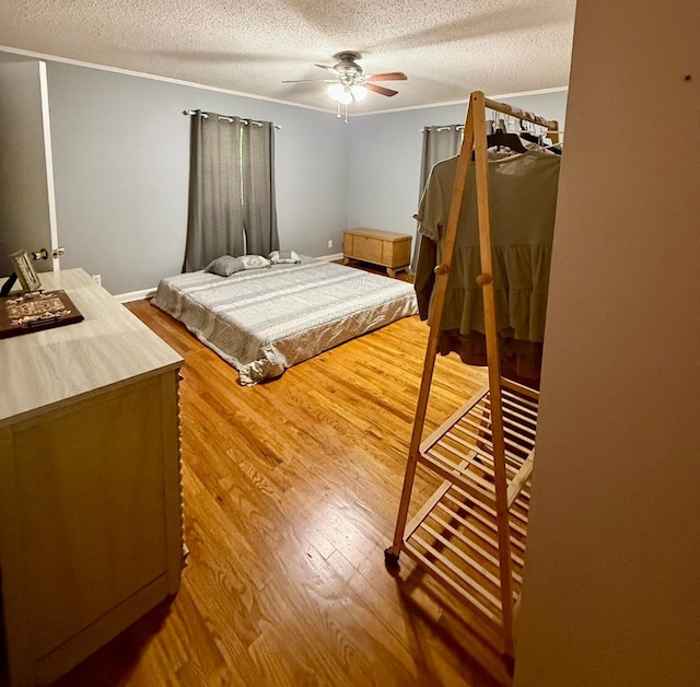 300 Mixson St, Enterprise, AL 36330 - bedroom featuring a textured ceiling, wood finished floors, and ceiling fan