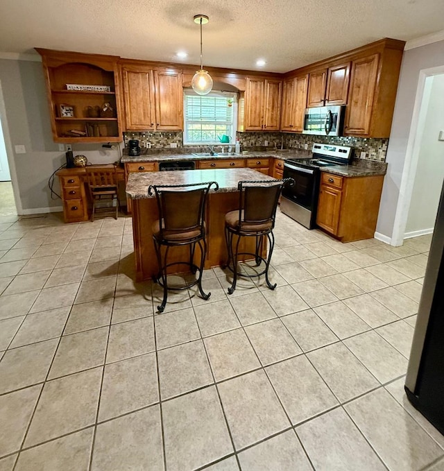 300 Mixson St, Enterprise, AL 36330 - kitchen with appliances with stainless steel finishes, brown cabinetry, backsplash, a textured ceiling, and crown molding