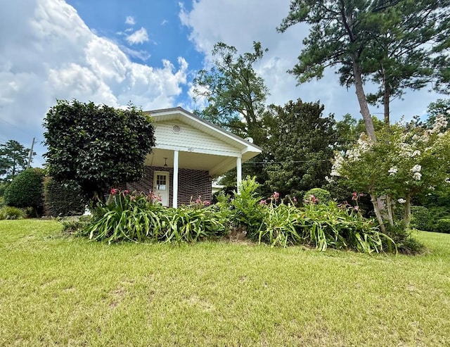 300 Mixson St, Enterprise, AL 36330 - view of home's exterior with a lawn and brick siding