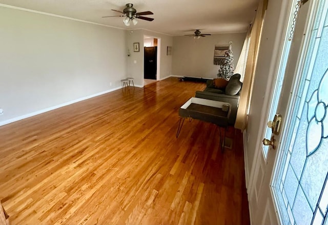 300 Mixson St, Enterprise, AL 36330 - unfurnished living room with ceiling fan, wood finished floors, and crown molding