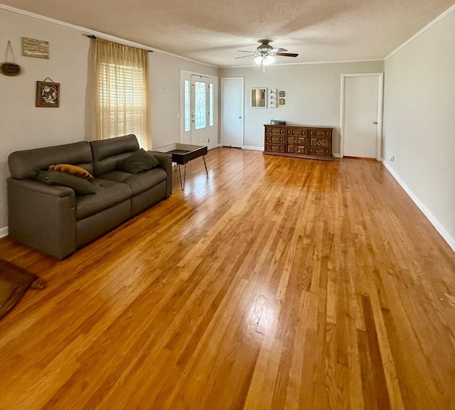 300 Mixson St, Enterprise, AL 36330 - living room featuring ornamental molding, a ceiling fan, wood finished floors, and a textured ceiling