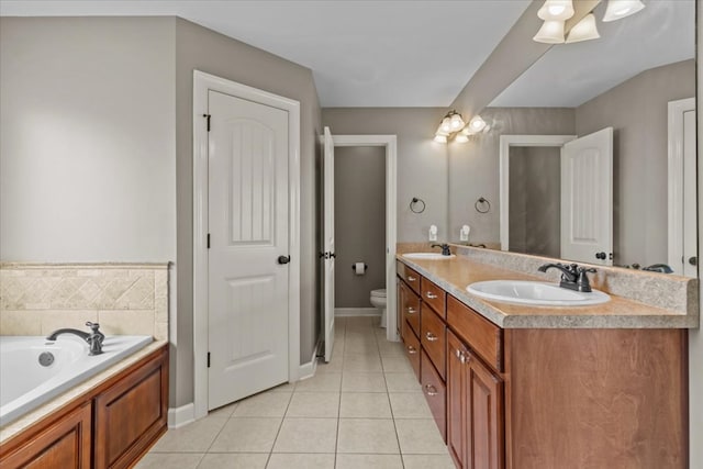 102 Tumbleweed Dr, Enterprise, AL 36330 - bathroom featuring double vanity, tile patterned floors, and a garden tub