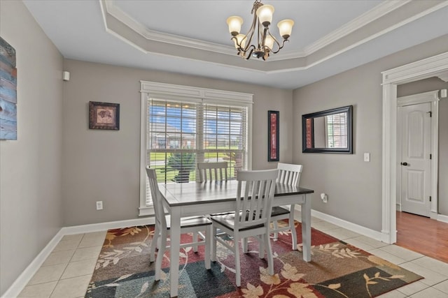 102 Tumbleweed Dr, Enterprise, AL 36330 - dining space featuring light tile patterned floors, a chandelier, ornamental molding, and a raised ceiling