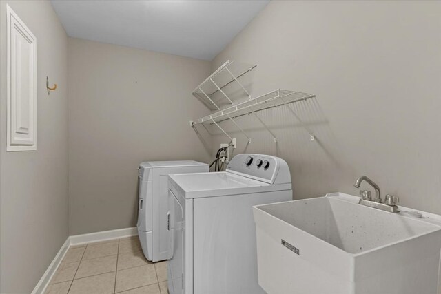 102 Tumbleweed Dr, Enterprise, AL 36330 - washroom with separate washer and dryer and light tile patterned floors