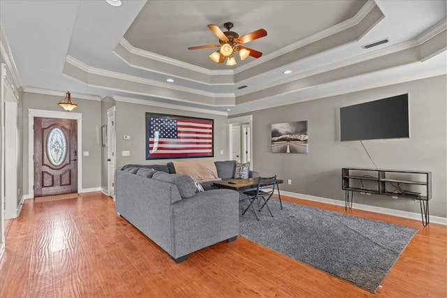102 Tumbleweed Dr, Enterprise, AL 36330 - living room with a raised ceiling, a ceiling fan, crown molding, wood finished floors, and recessed lighting