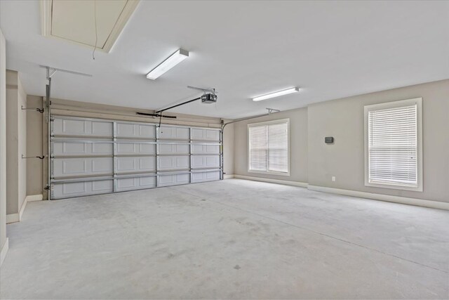 102 Tumbleweed Dr, Enterprise, AL 36330 - garage featuring a garage door opener and baseboards