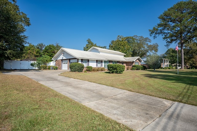 single story home with a front lawn and a garage