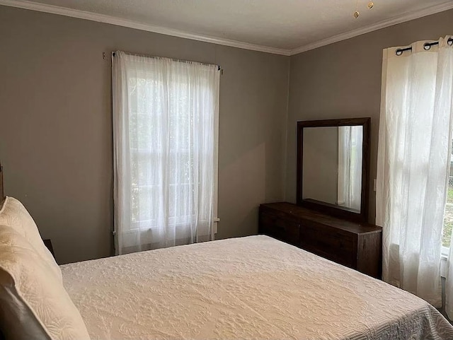 bedroom featuring crown molding