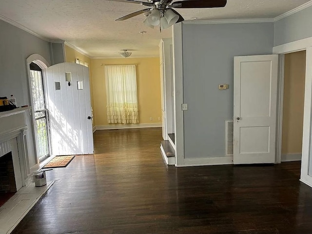 unfurnished living room featuring plenty of natural light, a ceiling fan, wood finished floors, and ornamental molding