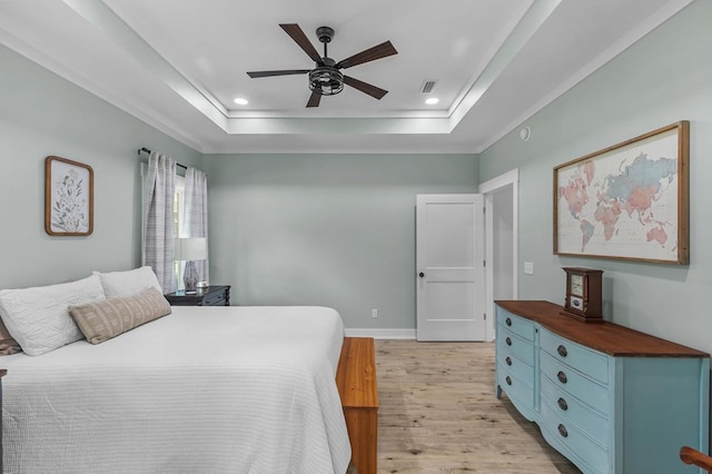 3155 Eddins Rd, Dothan, AL 36301 - bedroom with light wood-style flooring, a tray ceiling, recessed lighting, and ceiling fan
